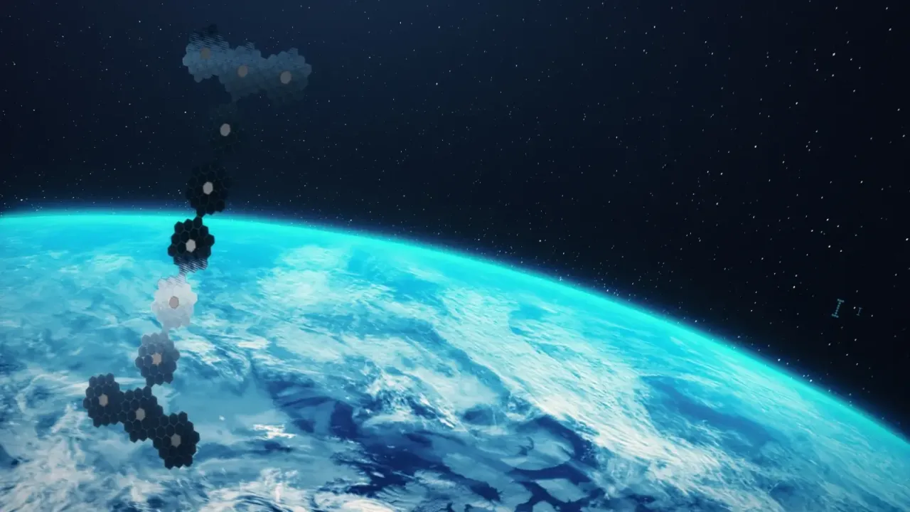 An artist's rendering of an orbital data centre structure above Earth, composed of hexagonal panels arranged in a vertical chain.
