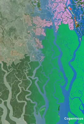 The Sundarbans mangrove forest in the Ganges delta, spanning the coastlines of Bangladesh and India, as depicted in a Copernicus LCFM land cover classification overlaid on satellite imagery. The classification distinguishes mangrove forest extent (green), permanent water bodies (blue), and surrounding cropland (pink). 
