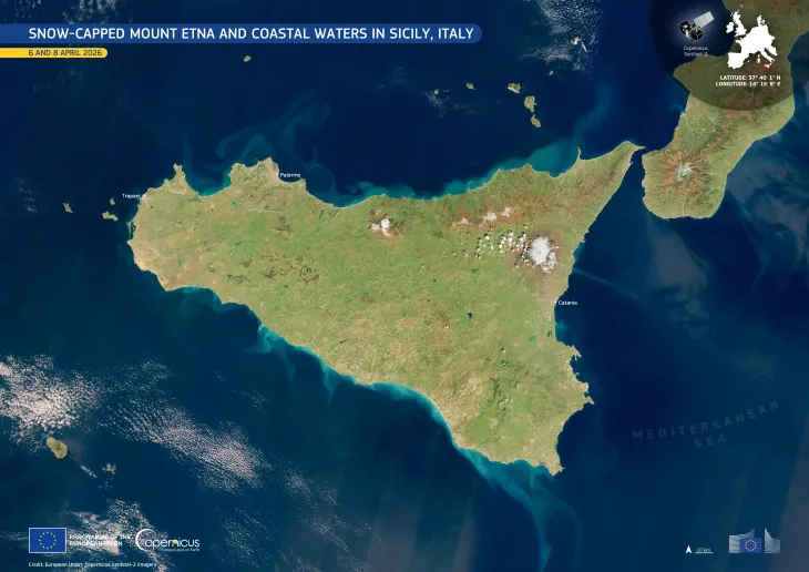 Snow-capped Mount Etna and coastal waters in Sicily, Italy