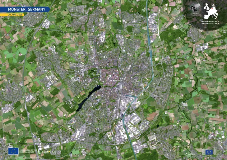 The satellite image shows the city of Munster surrounded by fields in different shades of brown.