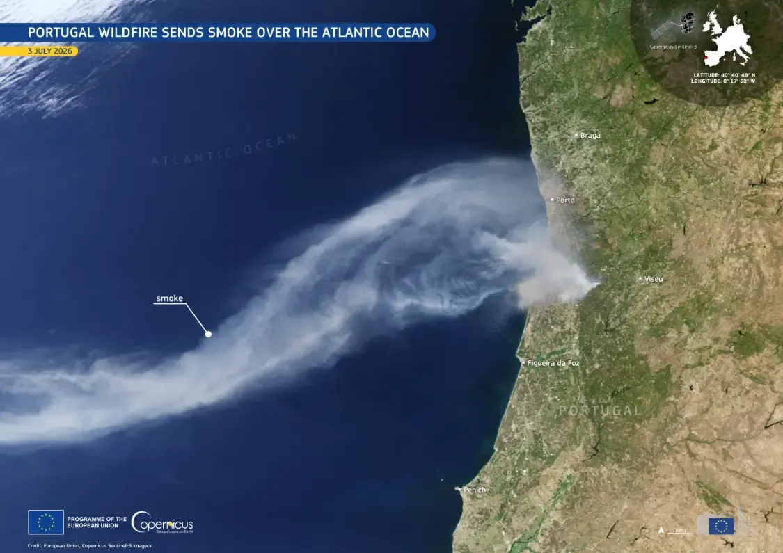 Satellite view of a pale wildfire smoke plume streaming from Portugal's coast out over the Atlantic Ocean.