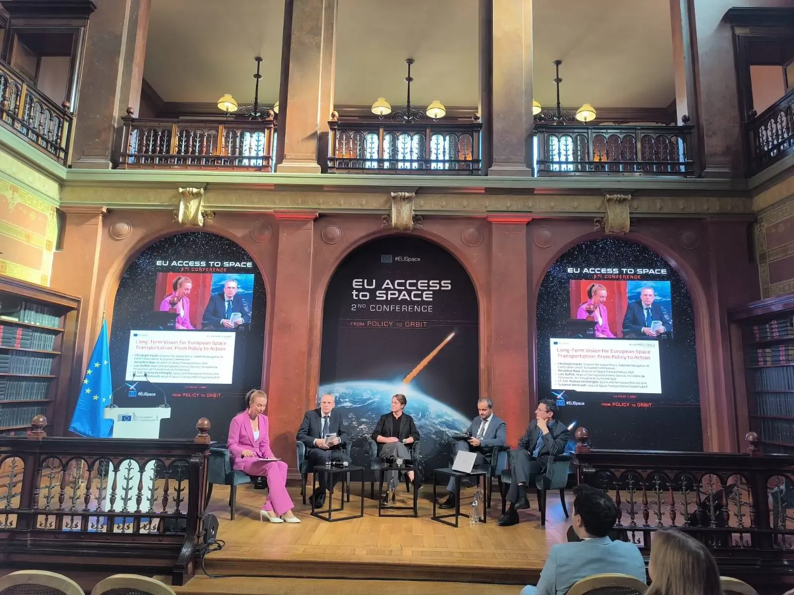 Five panellists seated on a stage beneath screens reading 'Long-Term Vision for European Space Transportation: From Policy to Action', in the Solvay Library.
