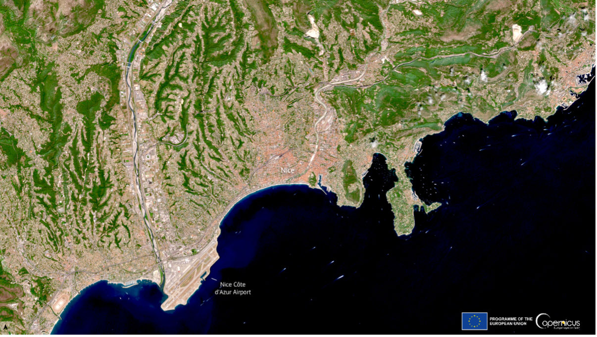 Satellite view of Nice, France, showcasing the urban layout, coastline, and Nice Côte d'Azur Airport along the Mediterranean coast.