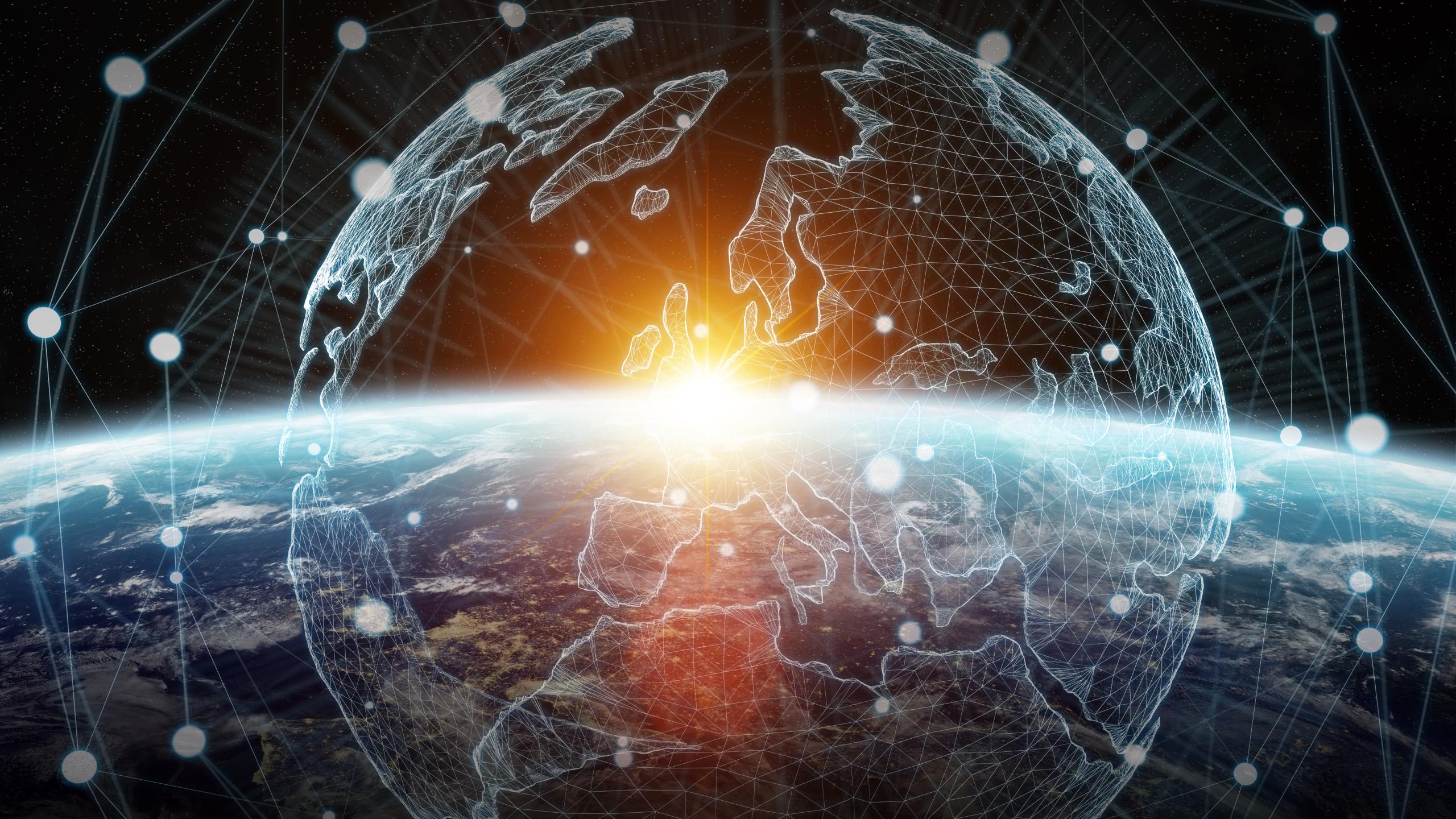 The image shows a view of Earth from space with a digital grid overlay outlining the continents, particularly Europe and Africa. The grid is interconnected by numerous points of light, symbolising a global network. A bright sunrise is seen on the horiz...