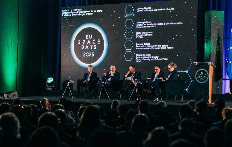 Panel of five speakers on the main stage at EU Space Days 2025 during the session “European Space Policy: Where do we stand &amp; what are the challenges ahead?”, with a large event screen and EU Space Days branding in the background.