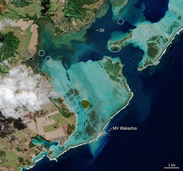 MV Wakashio stranded close to Pointe d’Esny, an important wetland area. The oil slick can be seen as a thin, black line surrounded by the bright turquoise colours of the Indian Ocean. Oil is visible near the vessel, as well as other locations around th...