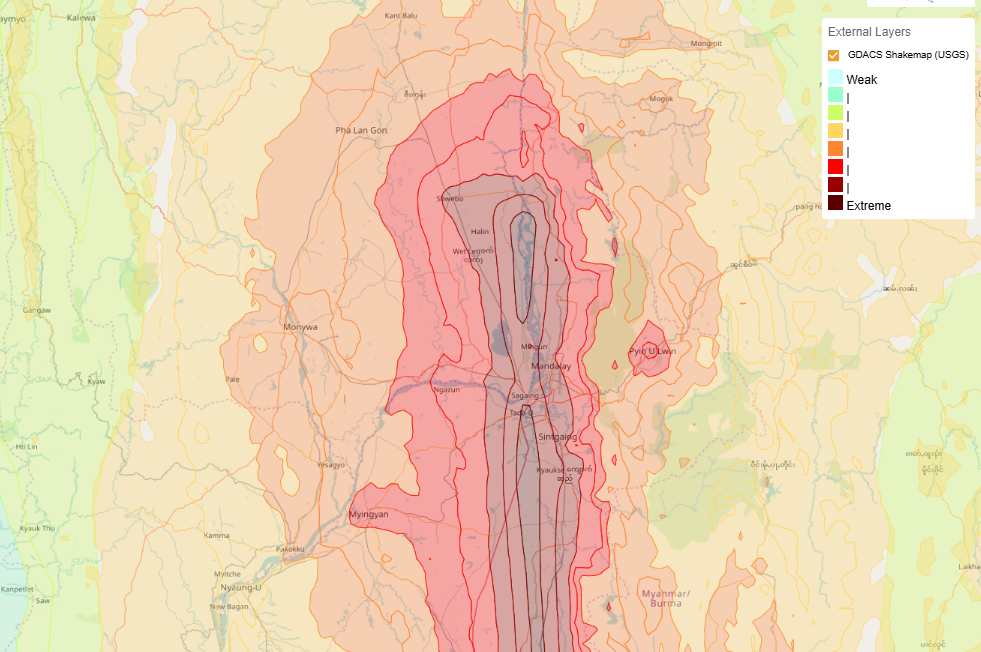 Map of central Myanmar showing earthquake intensity zones from GDACS ShakeMap (USGS). Colour gradients range from green (weak) to dark red and brown (extreme), with the most intense shaking affecting areas around Mandalay and Sagaing.