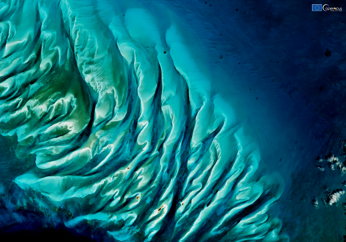 A blue and green water surface</p>
<p>Description automatically generated with medium confidence