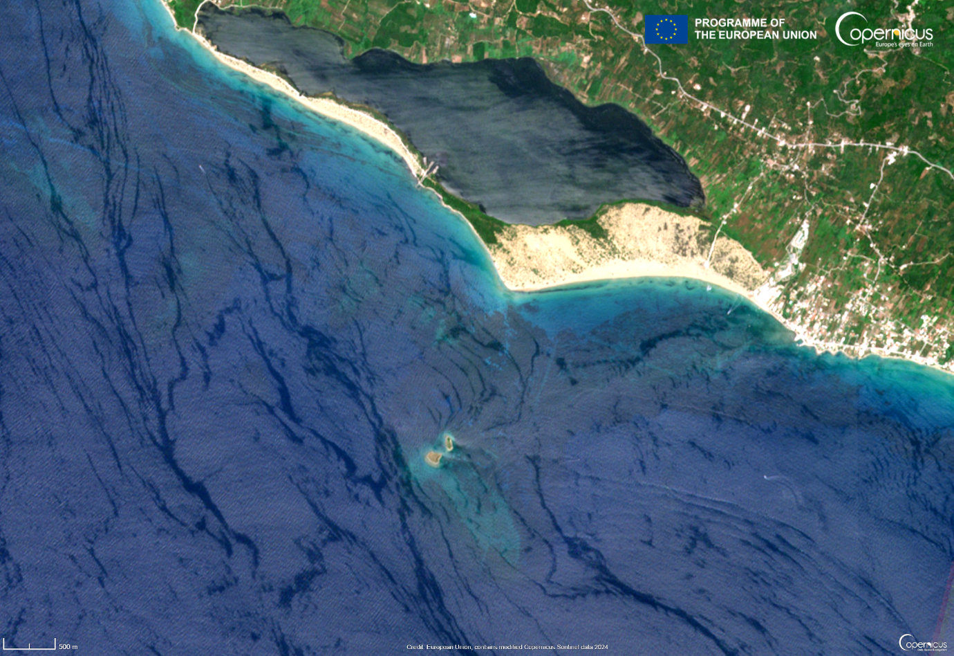 An aerial view of a beach</p>
<p>Description automatically generated