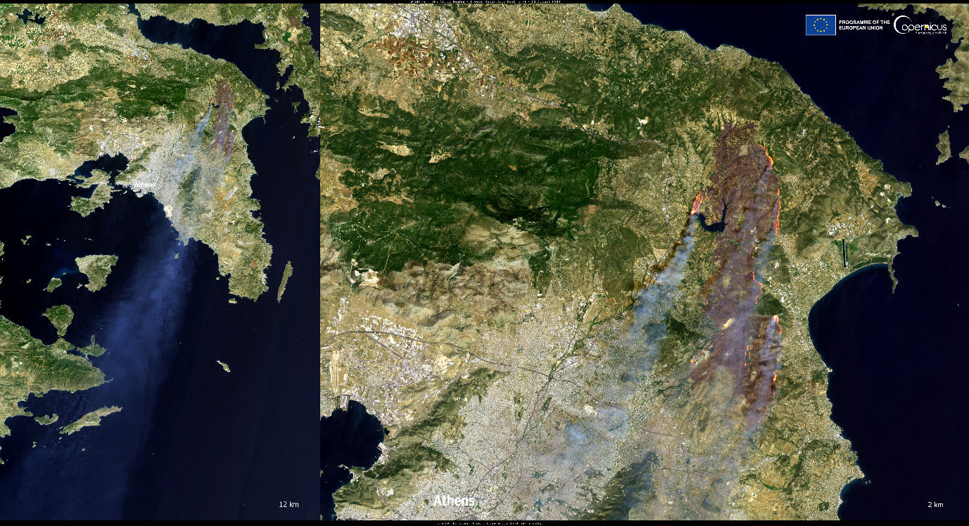 Satellite image showing large wildfire smoke plumes near Athens, Greece. The smoke drifts towards the west over the sea, with fire-affected areas visible in brown on the landscape.