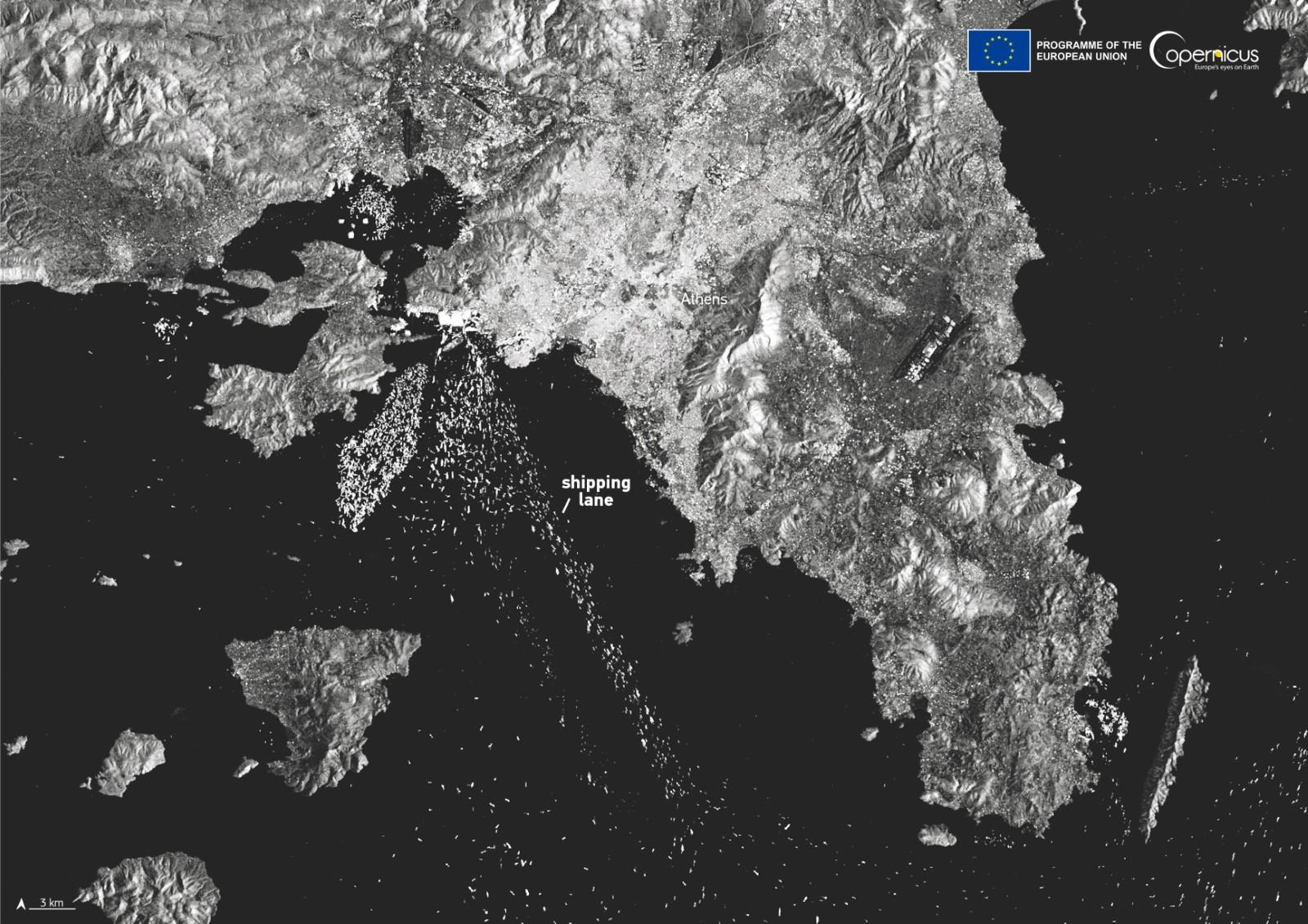 Sentinel-1 radar image showing shipping activity near Athens, Greece, with white dots representing vessels and distinct shipping lanes visible in the Aegean Sea.